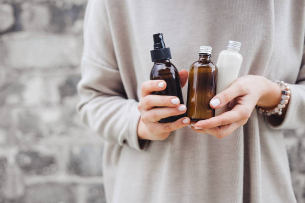 woman holding Different skin care products