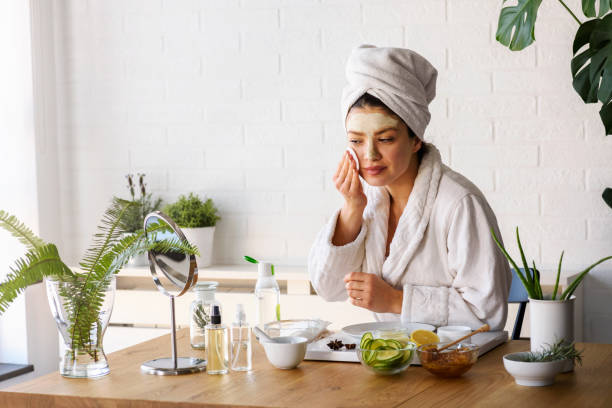 Woman applying skin care after her shower