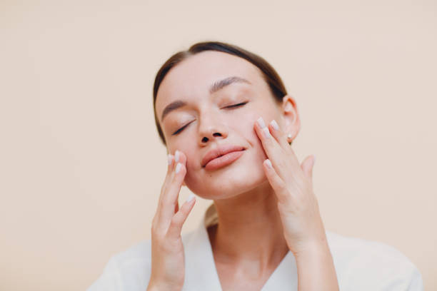 Woman applying skin care