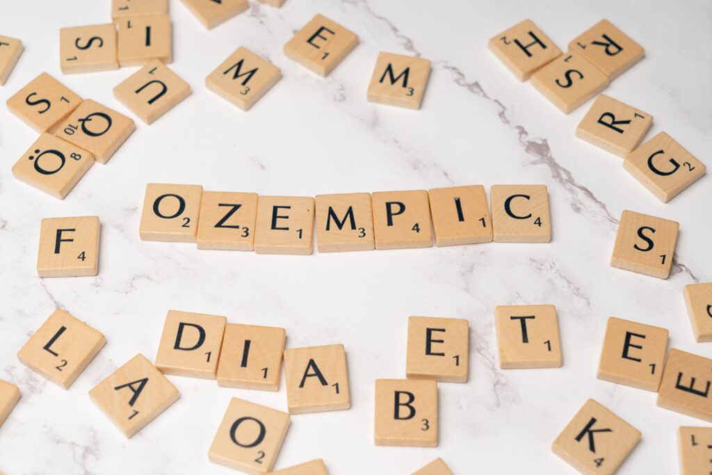 Scrabble letters forming the word "Ozempic"