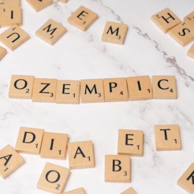 Scrabble letters forming the word "Ozempic"