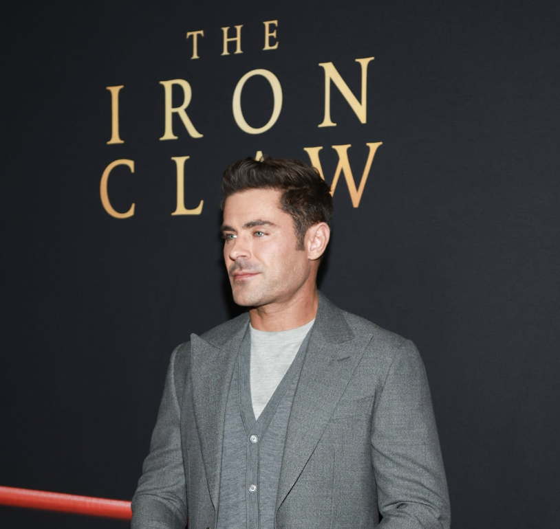 Zac Efron and his wrestler body post for the iron claw