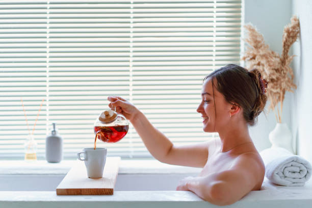 taking a bath while drinking a tea with herbs to help calm the brain and relax all throughout