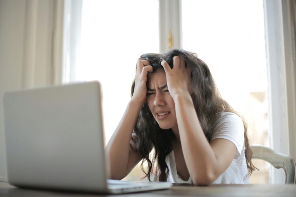 Woman experiencing immense stress due to her work